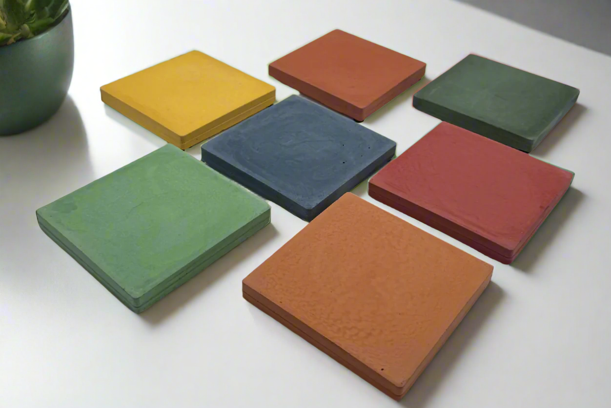 Vibrant color choices for square handcrafted concrete coasters: green, blue, yellow, orange, coral, and red hues