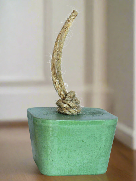 Handmade angular concrete door stop in green with sisal rope handle.